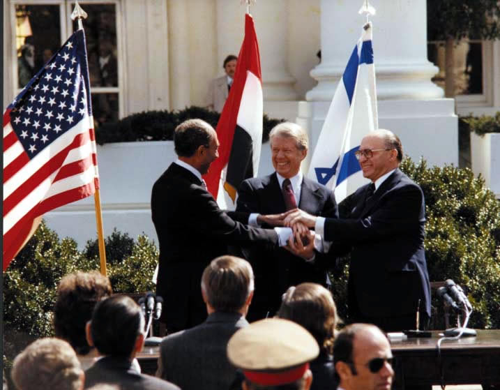 Carter_Sadat_and_Begin_at_the_Peace_Treaty_Signing_March_27_1979_10729561495